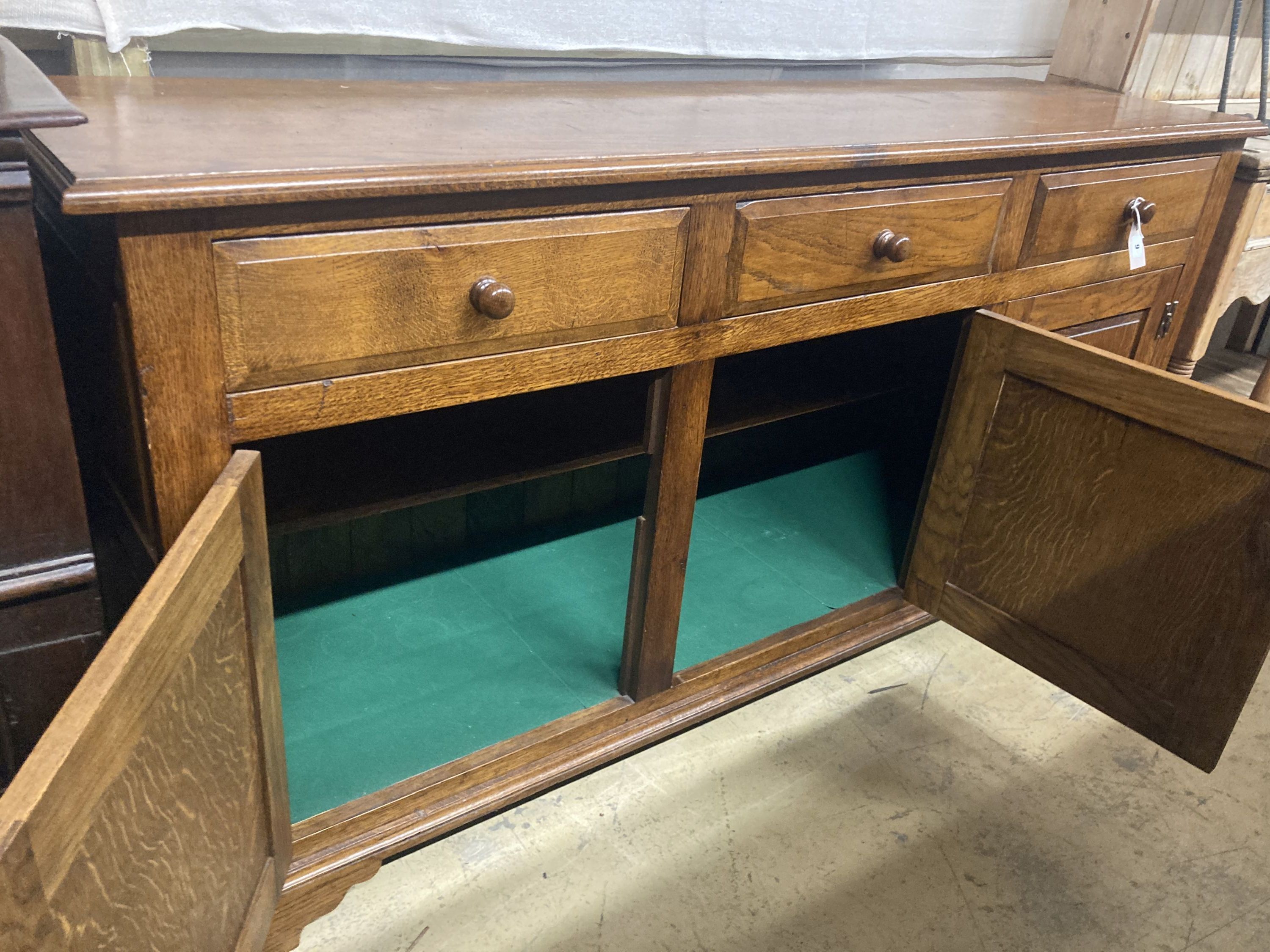 An 18th century style oak low dresser, width 170cm, depth 48cm, height 84cm